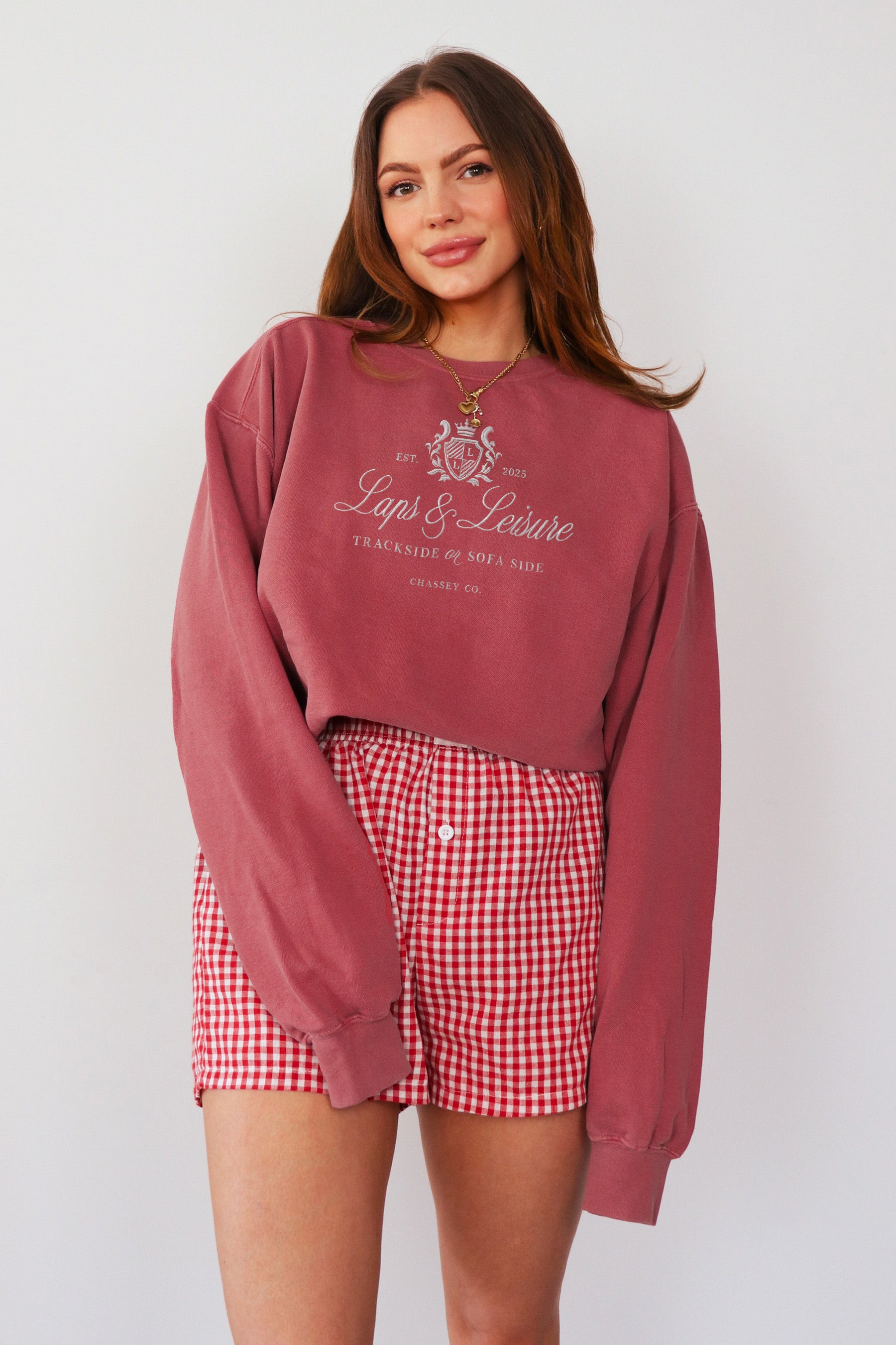 Model wearing Laps & Leisure embroidered sweatshirt in red