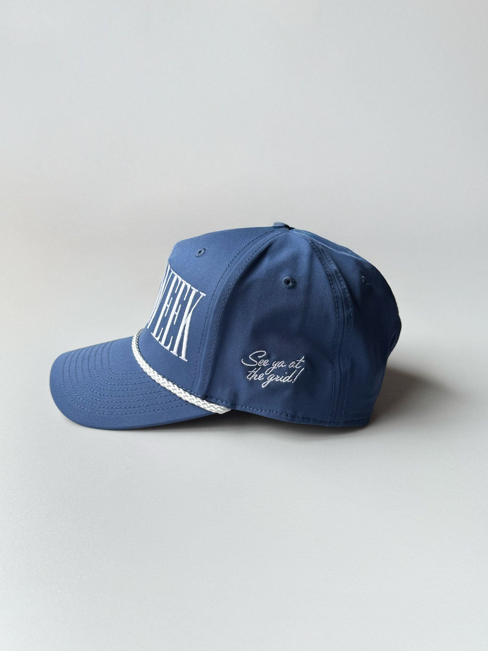 Detail of side embroidery of blue Race Week rope hat